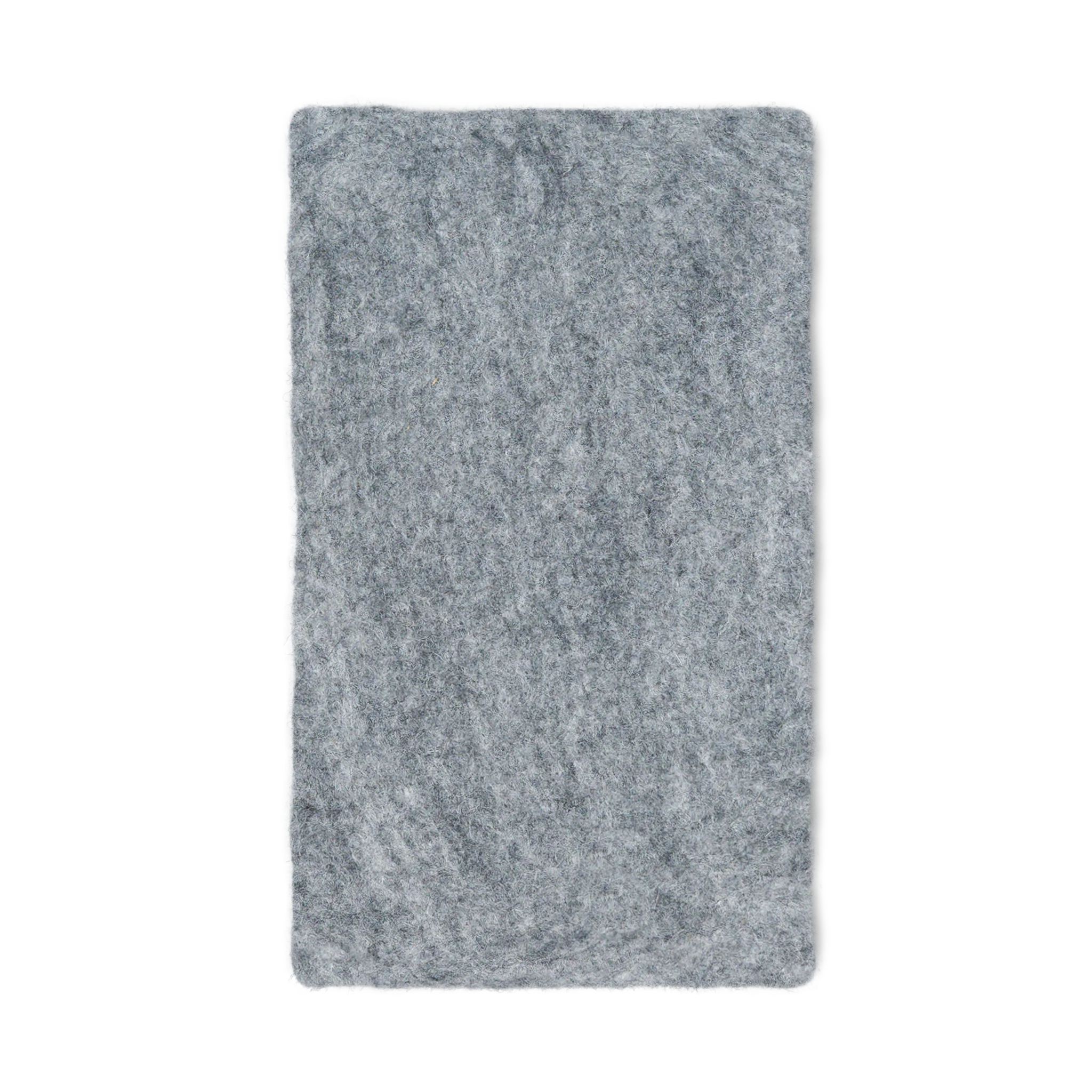 Light grey rectangular felted wool cat carrier cushion on a white background.