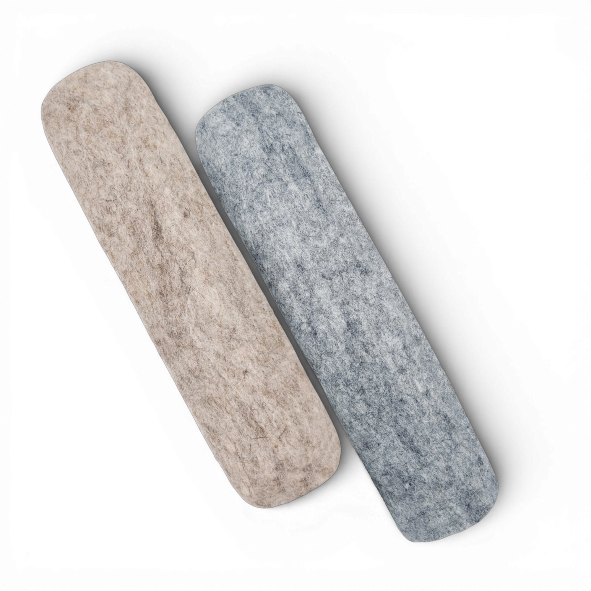 Light brown and light grey felted wool cat kicker toys side by side on a light background.