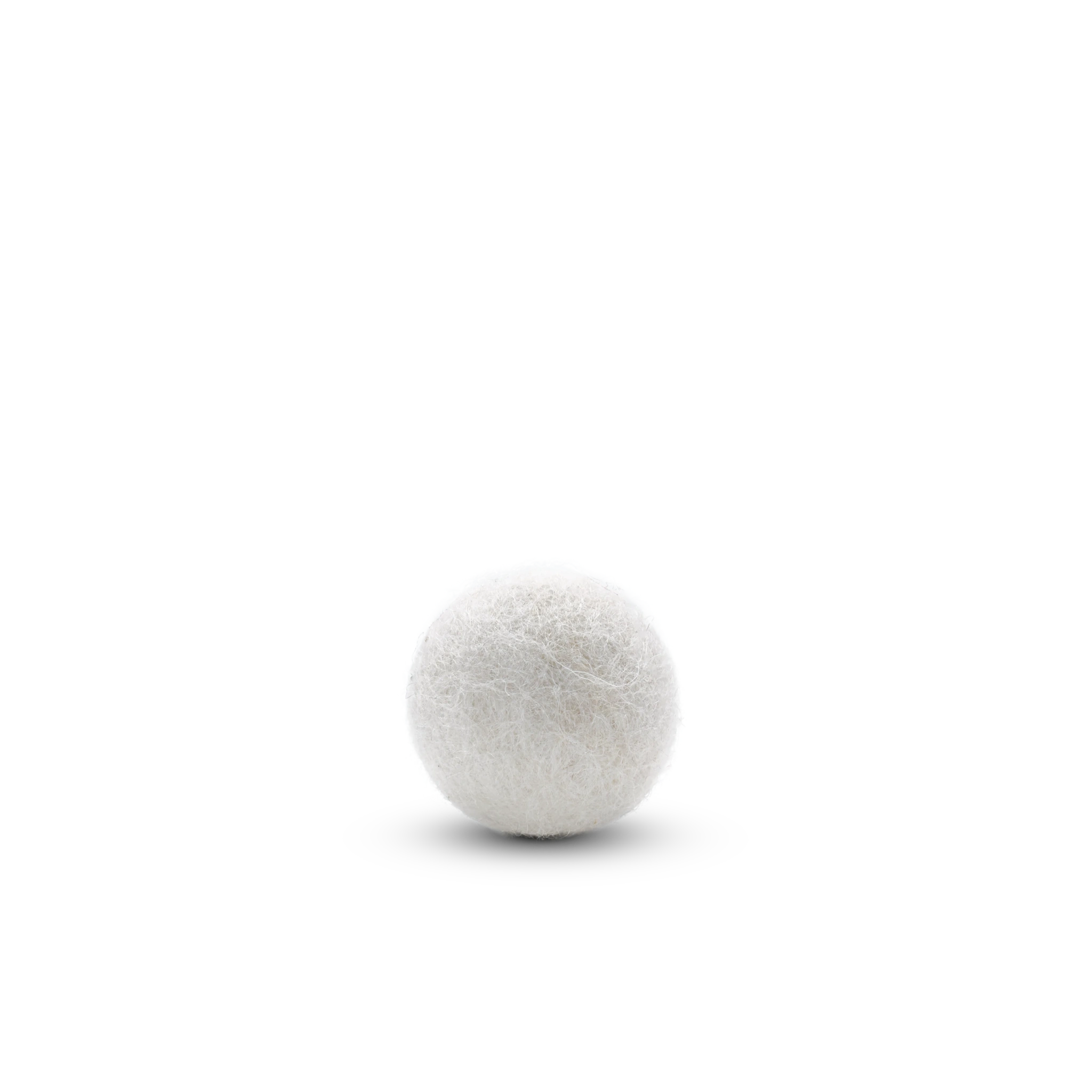 Single white felted wool ball cat toy on a light background.