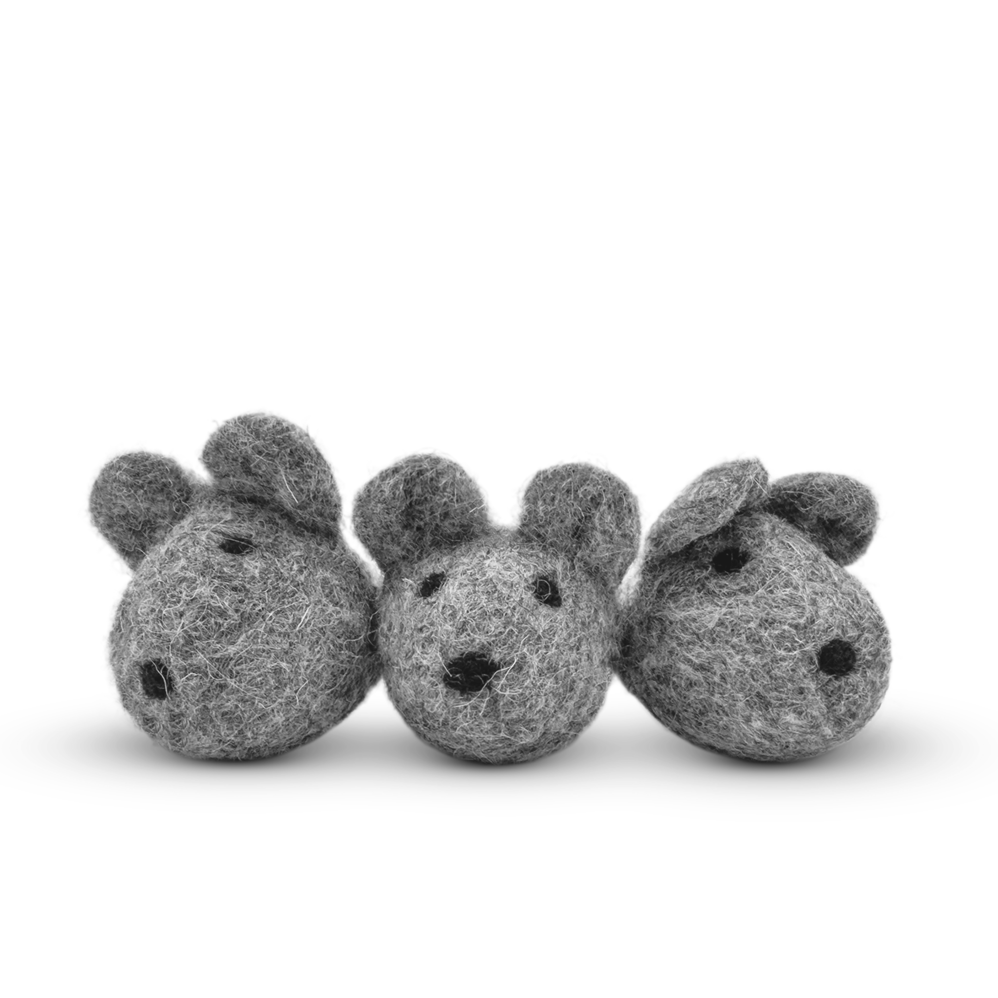 White felted wool mice cat toy on a light background.